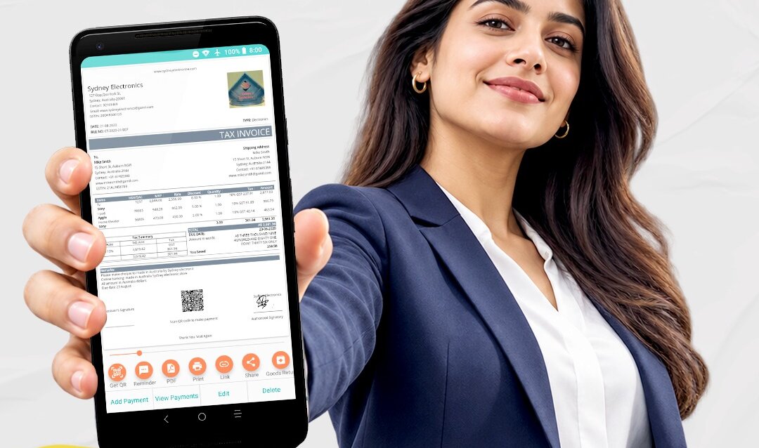 A business owner holding up a GST tax invoice made in the Momobills app